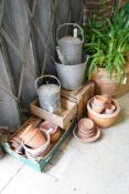 A quantity of vintage terracotta pots, two galvanised cans, bucket and two wood crates