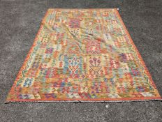 An Anatolian polychrome geometric flatweave Kilim carpet, 290 x 210cm