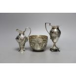 Two late 19th/early 20th century silver cream jugs, 13.5cm, and a late Victorian silver sugar