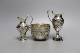 Two late 19th/early 20th century silver cream jugs, 13.5cm, and a late Victorian silver sugar