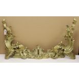 A French rococo style bronze adjustable chenet