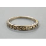A white metal and diamond chip set half eternity ring, size K,gross 1.9 grams.