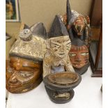 A group of West African tribal artefacts, including a Cross River Egungun mask, 48 x 20cm, a