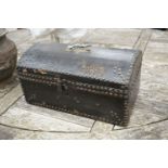 An early 19th century small domed topped leather trunk, bears interior label John Shepherd, Trunk