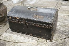 An early 19th century small domed topped leather trunk, bears interior label John Shepherd, Trunk