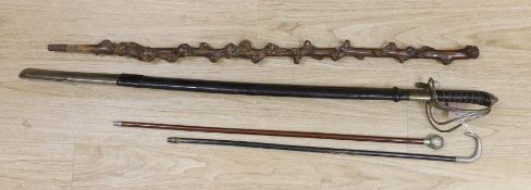 A Victorian officer's sword, two swagger sticks, and a rootwood walking cane (4)