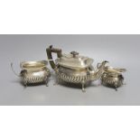 An Edwardian silver three piece bachelor's tea set, William Hutton & Sons, London, 1903, gross 17