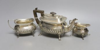 An Edwardian silver three piece bachelor's tea set, William Hutton & Sons, London, 1903, gross 17