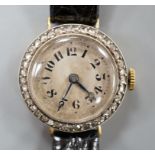 A lady's early 20th century 18k and diamond set manual wind wrist watch, on later leather strap,