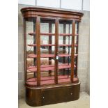 A Victorian mahogany shop display cabinet on later base, width 150cm, depth 32cm, height 209cm