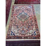 A North West Persian peach ground rug, 240 x 140cm