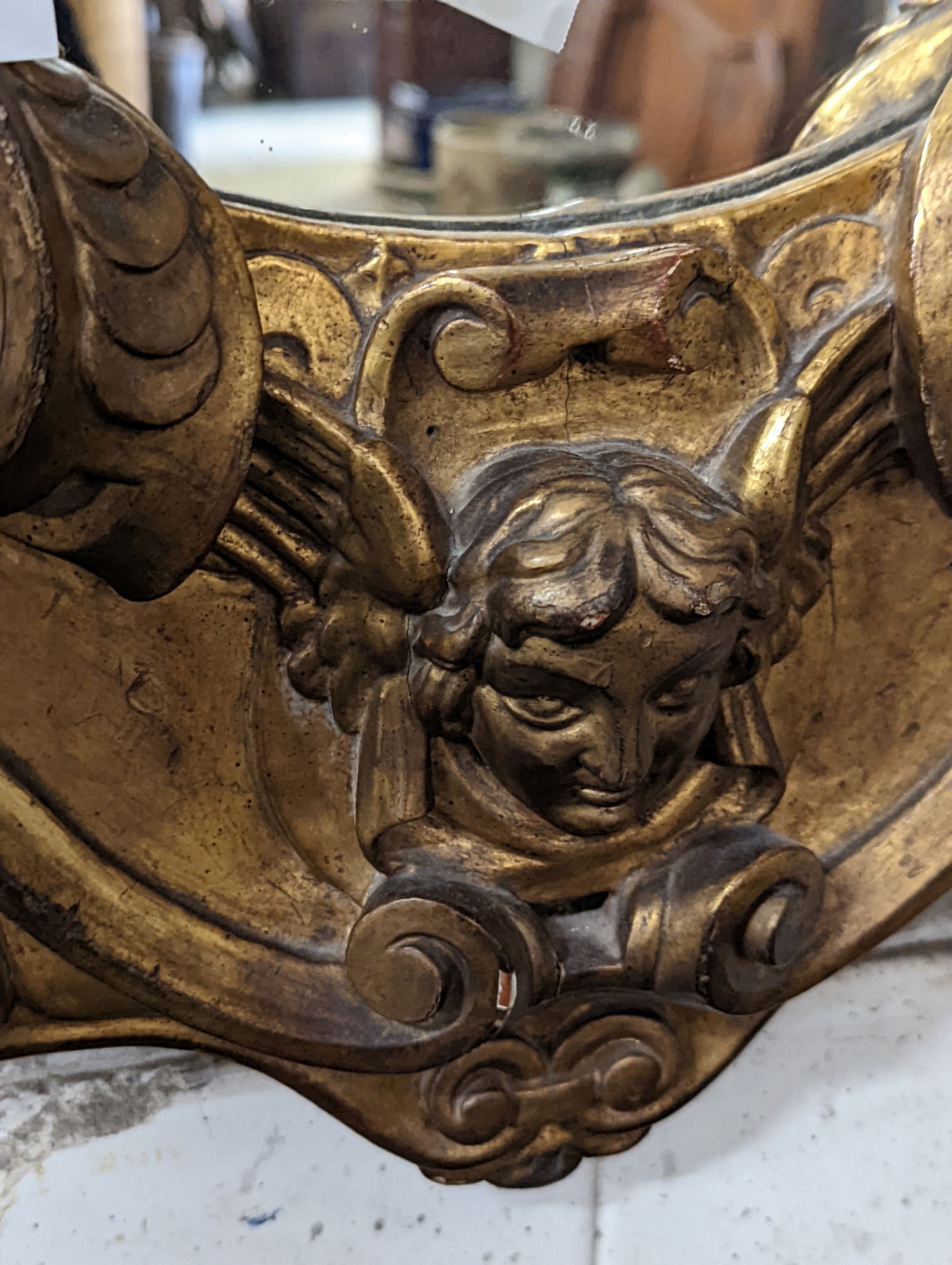 A Victorian carved giltwood oval wall mirror decorated with cherubs and C scrolls., width 74cm, - Image 7 of 10