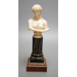 A 19th-century Dieppe ivory bust of Clytie, on a marble and rosewood pedestal, after the model in