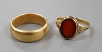 A George V 18ct gold wedding band, size Q, 14 grams and a 333 standard yellow metal and carnelian