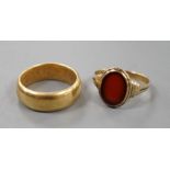 A George V 18ct gold wedding band, size Q, 14 grams and a 333 standard yellow metal and carnelian