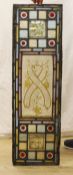 Two pairs of 19th century leaded and stained glass panels,111cms high x 36.5 wide.