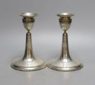 A pair of Edwardian silver mounted dwarf candlesticks, William Comyns, London, 1906, height 14.
