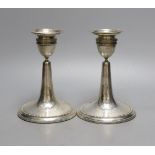 A pair of Edwardian silver mounted dwarf candlesticks, William Comyns, London, 1906, height 14.