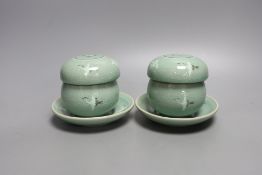 A pair of Korean green glazed pottery tea bowls, cover and stand with strainer each inside - 11cm