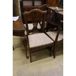 A set of nine George III and later mahogany dining chairs with pierced splats and upholstered drop