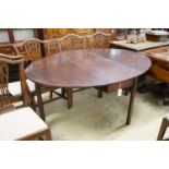 A George III oval mahogany drop leaf dining table, length 160cm extended, width 123cm, height 72cm