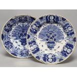 Two similar early 18th century Dutch Delft peacock pattern chargers,largest 33cms diameter.