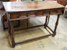 A Tuscan style walnut hall table with frieze drawers over turned legs united by stretchers, width