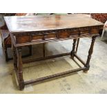 A Tuscan style walnut hall table with frieze drawers over turned legs united by stretchers, width