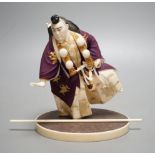 A Japanese ivory figure of a performing Yamabushi warrior monk, Taisho/early Showa period, signed to