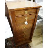 A 1920's oak Wellington chest, width 51cm depth 34cm height 105cm