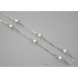 A modern Italian 750 white metal baton link and cultured pearl set necklace, 58cm, gross weight 12.7