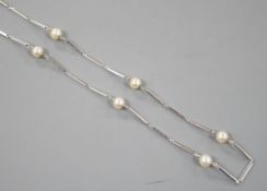 A modern Italian 750 white metal baton link and cultured pearl set necklace, 58cm, gross weight 12.7