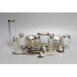 Eleven assorted silver topped glass toilet jars, a pair of 800 salts and eight other items.
