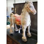 A vintage Mobo painted tinplate toy sit on horse, length 66cm