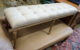 A reproduction George III style bleached window seat with buttoned natural fabric upholstery, length