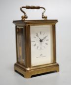 A Mathew Norman miniature brass carriage timepiece,6cms high.