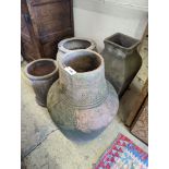 A large incised terracotta garden urn, height 72cm together with three other large earthenware