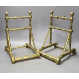 A pair of 19th century Dresser or Godwin style brass fire dogs