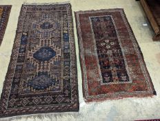 Two Caucasian geometric polychrome rugs, largest 190 x 96cm