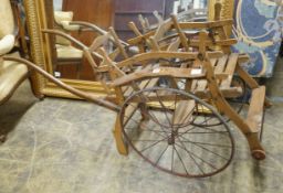 A small oak framed dog cart, width 48cm, length 150cm