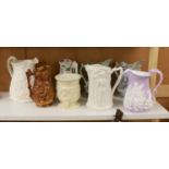 Eight Victorian relief moulded earthenware jugs relating to historic battles and the military