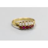 A late Victorian 18ct gold, graduated five stone ruby and five stone diamond set twin row ring, size