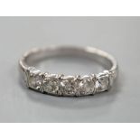 An 18ct white metal and five stone diamond set half hoop ring, size R, gross weight 3.4 grams.