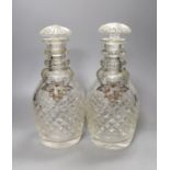 A pair of cut glass decanters with stoppers and Victorian silver ‘sherry’ and ‘claret’ labels, Reily