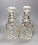 A pair of cut glass decanters with stoppers and Victorian silver ‘sherry’ and ‘claret’ labels, Reily