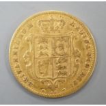 A Victorian 1871 gold shield back half sovereign, London Mint.