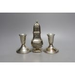 A modern pair of sterling mounted dwarf candlesticks, 92mm and a George V silver sugar caster, 16.