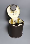 A Connolly leather Krug champagne carrier with dust cover, containing: two half bottles, two