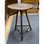 A 19th century circular primitive cricket table, diameter 49cm, height 71cm