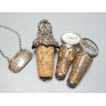 A George III silver 'Madeira' wine label, London, 1803 and three mounted cork bottle stoppers.